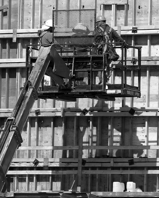 Construction in progress 3 construction worker on the crane